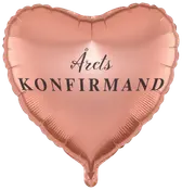 Hjärformad, metallic roséguldfärgad ballong med svart text "Årets Konfirmand". Passar till konfirmationsfirande, blank yta och elegant design.