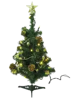 Liten konstgjord julgran med guldfärgade dekorationer, kottar, gula LED-lampor och guldfärgad stjärna. Levereras med svart fot, passar bord eller små utrymmen.