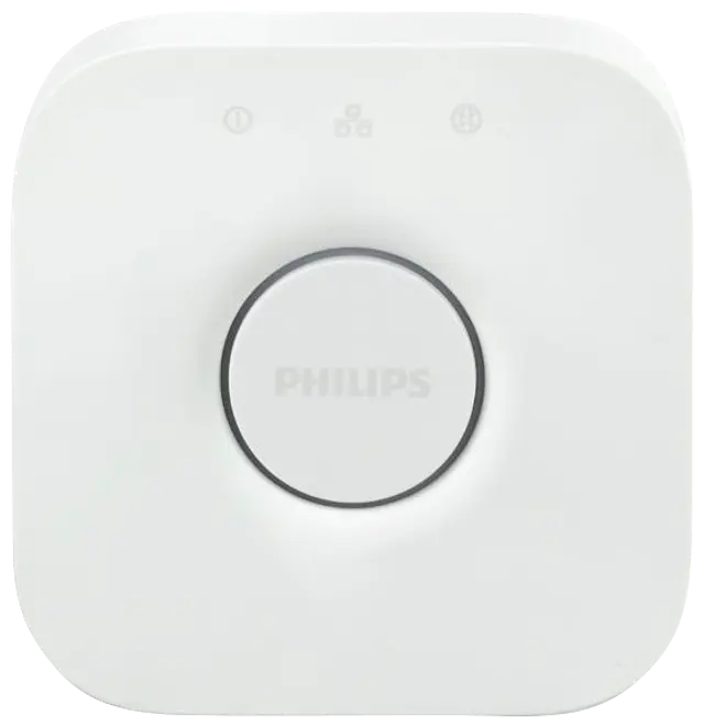 Hvid Philips Hue Bridge smart home-hub, firkantet med afrundede hjørner, central rund knap, diskret logo og tre små indikatorikoner øverst.