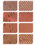Set med åtta bruna presentpapper med metallic foliemönster av julgranar i silver, rött, orange och guld. Varje ark har unikt trädmotiv och festliga detaljer.