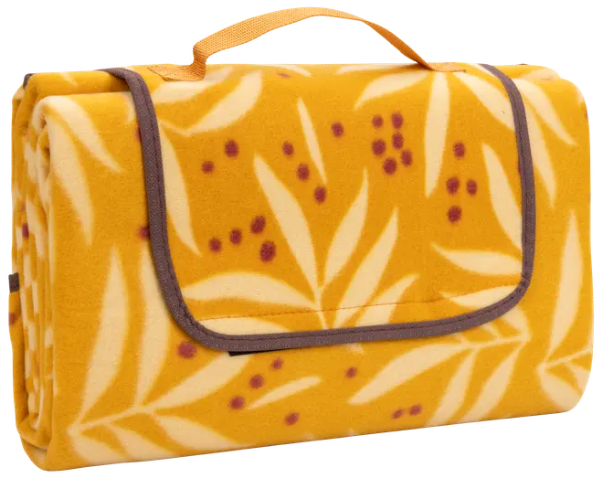 Sammenfoldeligt picnic-tæppe i gul og creme med bladmønster, lilla prikker, brun kant og bærehåndtag. Blødt fleece-materiale, kompakt og nemt at transportere.