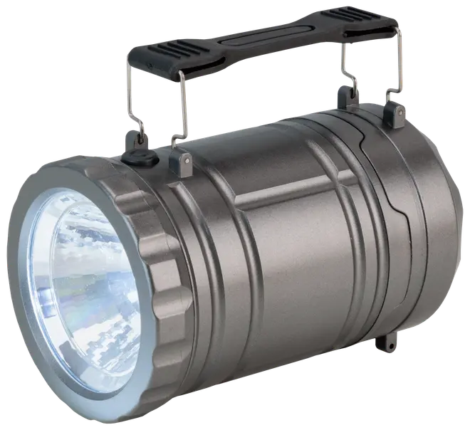 Robust bærbar LED-spotlight med cylindrisk metalkrop, stor frontlinse og solid sort bærehåndtag. Perfekt til udendørs brug, camping eller nødsituationer.