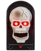 Halloween-dörrklocka med vit dödskalle på svart rektangulär bas, röd knapp längst ner och diskreta röda LED-lampor för skrämmande dekoration.