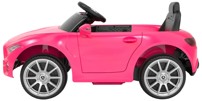 Lyserød elbil til børn, Mercedes-Benz stil, sølvfarvede hjul, sort sæde og rat. Åben kabine, realistiske detaljer, egnet til leg både inde og ude.