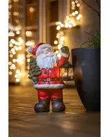Jultomte med gran och lanterna