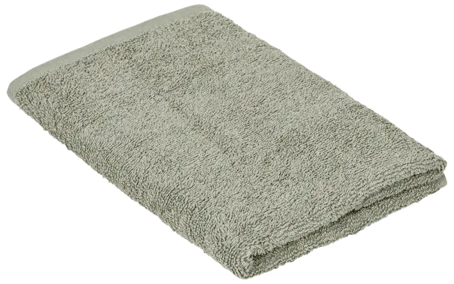 Vikt ljusgrå frottéhandduk med mjuk, texturerad yta och snyggt fållade kanter.