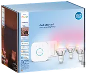 Philips Hue Essential GU10 startpakke med tre smarte LED-pærer, Hue Bridge og trådløs dæmperkontakt. Giver hvidt og farvet lys, kompatibel med smart home-systemer.