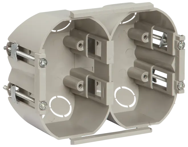 Dobbelt installationsdåse i plast, lysegrå, med monteringsskruer og kabelindgange, beregnet til indbygning af stikkontakter eller afbrydere i gips- eller murstensvægge.