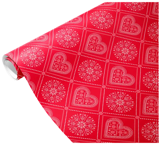 Rött presentpapper med vita hjärtan och snöflingor i rutmönster. Blank yta, perfekt för festliga tillfällen och inslagning av presenter.