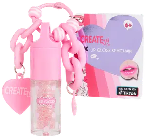 Lyserød lipgloss-nøglering med kraftig kæde, hjertevedhæng og glitrende gloss. Inkluderer emballage med hjertedesign, egnet til børn fra 6 år. Kompakt og bærbar.