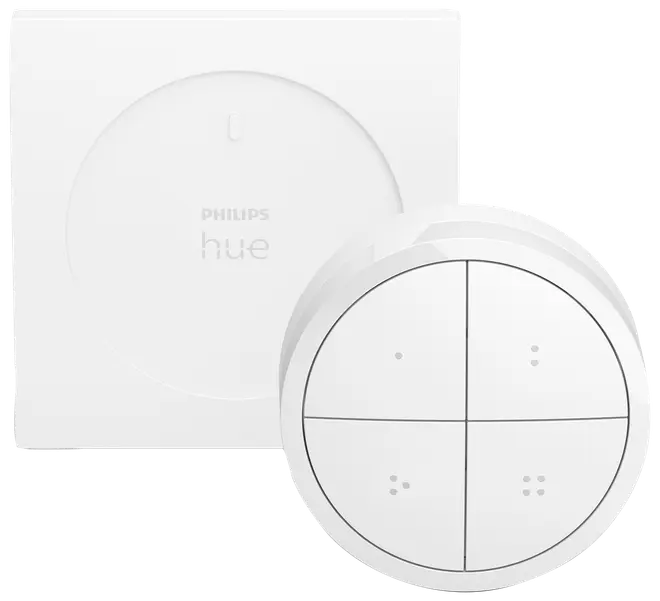 Philips Hue smart fjernbetjening med fire knapper, cirkulært design og vægbeslag. Minimalistisk hvid finish, bruges til styring af smart belysning. Inkluderer fjernbetjening og monteringsplade.
