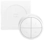 Philips Hue smart fjernbetjening med fire knapper, cirkulært design og vægbeslag. Minimalistisk hvid finish, bruges til styring af smart belysning. Inkluderer fjernbetjening og monteringsplade.