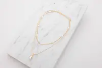 Halsband med pärlor - guld