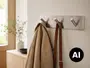 Vægmonteret knagerække i børstet sølv med tre skråtstillede kroge på en rektangulær metalplade, perfekt til frakker, tasker og bælter. - Billedet er skabt med AI