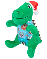 Grön dinosaurie-mjukisdjur med röd tomteluva och blå tröja med festliga djuransikten och polkagrisar. Mjuk, kramvänlig och perfekt som julklapp.