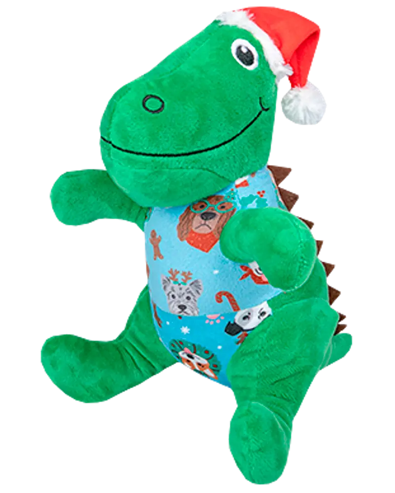 Grön dinosaurie-mjukisdjur med röd tomteluva och blå tröja med festliga djuransikten och polkagrisar. Mjuk, kramvänlig och perfekt som julklapp.