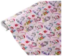 The image shows a roll of wrapping paper with a festive design featuring cartoon unicorns in various winter and holiday outfits. The unicorns are depicted wearing Santa hats, scarves, earmuffs, and winter coats, some holding presents or riding snowboards. The background is light pink and decorated with small illustrations of candy canes, gingerbread men, snowflakes, stars, and wrapped gifts, creating a cheerful and playful holiday theme.
