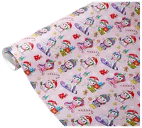 The image shows a roll of wrapping paper with a festive design featuring cartoon unicorns in various winter and holiday outfits. The unicorns are depicted wearing Santa hats, scarves, earmuffs, and winter coats, some holding presents or riding snowboards. The background is light pink and decorated with small illustrations of candy canes, gingerbread men, snowflakes, stars, and wrapped gifts, creating a cheerful and playful holiday theme.