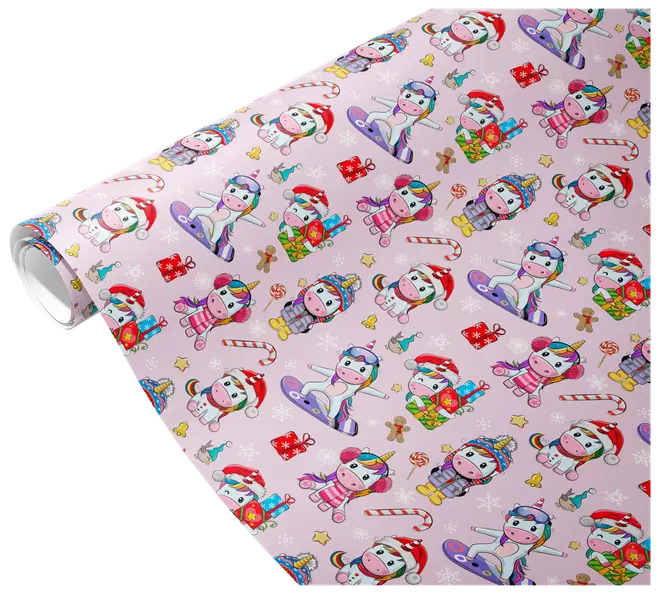 The image shows a roll of wrapping paper with a festive design featuring cartoon unicorns in various winter and holiday outfits. The unicorns are depicted wearing Santa hats, scarves, earmuffs, and winter coats, some holding presents or riding snowboards. The background is light pink and decorated with small illustrations of candy canes, gingerbread men, snowflakes, stars, and wrapped gifts, creating a cheerful and playful holiday theme.