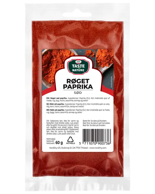 60g återförslutningsbar plastpåse med Taste Nature rökt söt paprika, flerspråkig etikett och fönster som visar det röda kryddpulvret inuti.