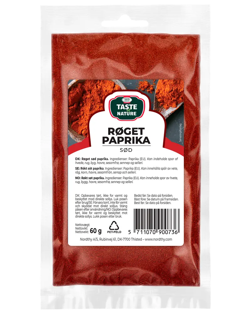 60g återförslutningsbar plastpåse med Taste Nature rökt söt paprika, flerspråkig etikett och fönster som visar det röda kryddpulvret inuti.