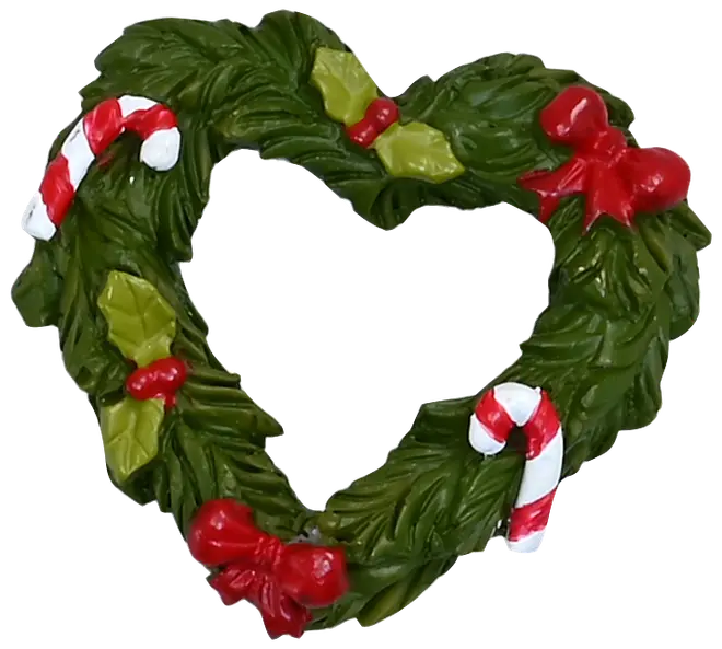 Hjerteformet julekrans med grønne blade, røde sløjfer, kristtornbær og rød-hvide slikstokke. Dekorativt juleornament til hjemmets udsmykning eller dørhængning.