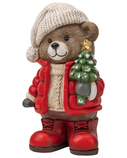 Festlig teddybjørn-figur med strikket hue og rød jakke, der holder et lille juletræ og har røde støvler.