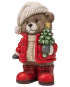 Festlig teddybjørn-figur med strikket hue og rød jakke, der holder et lille juletræ og har røde støvler.