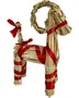 Håndlavet julebuk af halm, pyntet med røde bånd om ben, krop, hals og hale. Traditionel skandinavisk juledekoration med flettede detaljer og festlige bånd.