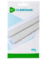 Pakke med hvide klæbemasse-strimler, 60g, til ophængning af plakater eller lette genstande. Rektangulær papemballage med blå og grønne detaljer.