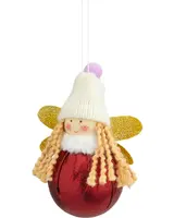 Juldekoration formad som en ängel med röd klotkropp, gyllene glittervingar, lockigt blont hår, vit stickad mössa med lila tofs och leende ansikte.