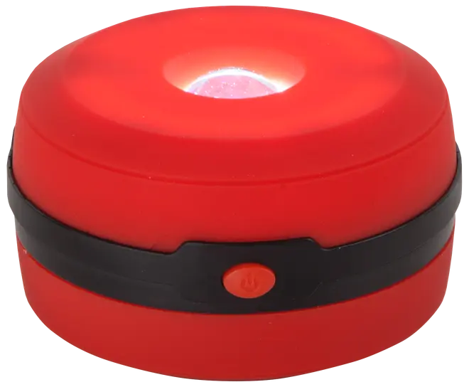 Kompakt röd LED-campinglampa med svart band och orange strömknapp. Har central ljuskälla, portabel design och passar för utomhus- eller nödsituationer.