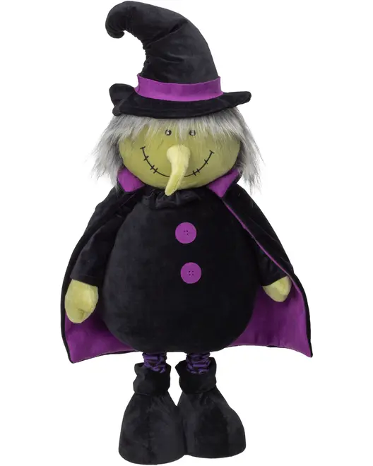 Sort og lilla heksedukke med spids hat, gråt hår, syet smil, lang næse, kappe, knapper og store sorte støvler.