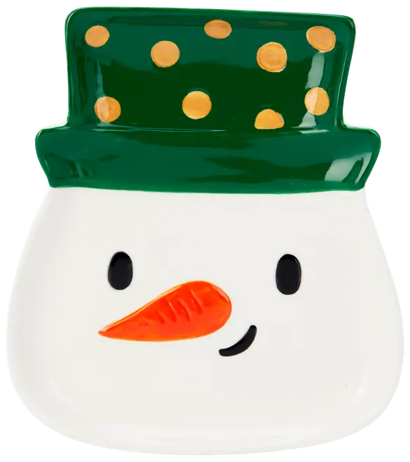 Keramiktallrik formad som en snögubbes ansikte med grön hatt och gula prickar, svarta ögon, orange morotsnäsa och ett litet leende. Festlig design för julen.
