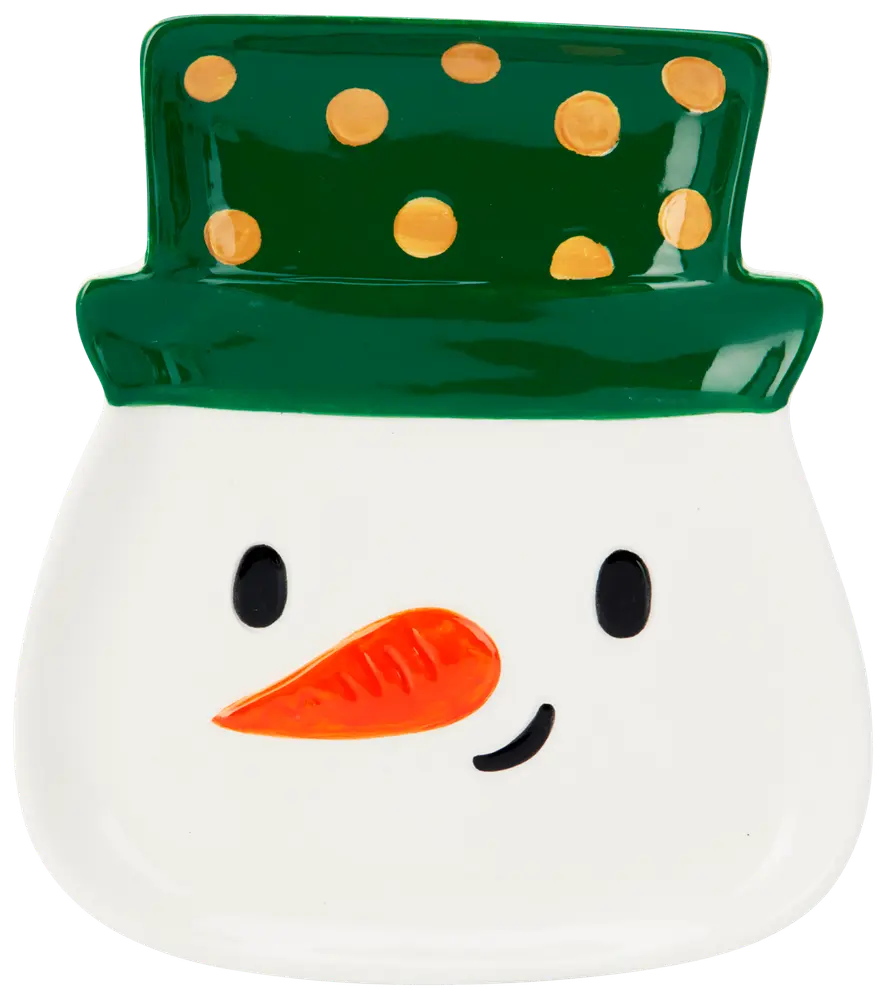 Keramiktallrik formad som en snögubbes ansikte med grön hatt och gula prickar, svarta ögon, orange morotsnäsa och ett litet leende. Festlig design för julen.