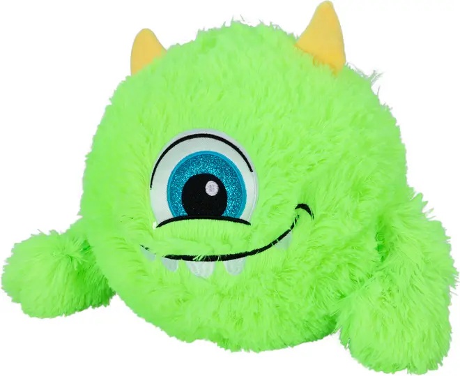 Lysende grøn plys-monsterbamse med ét stort blåt øje, to gule horn, bredt smilende mund med hvide tænder og blød, fluffy tekstur. Velegnet til børn og samlere.