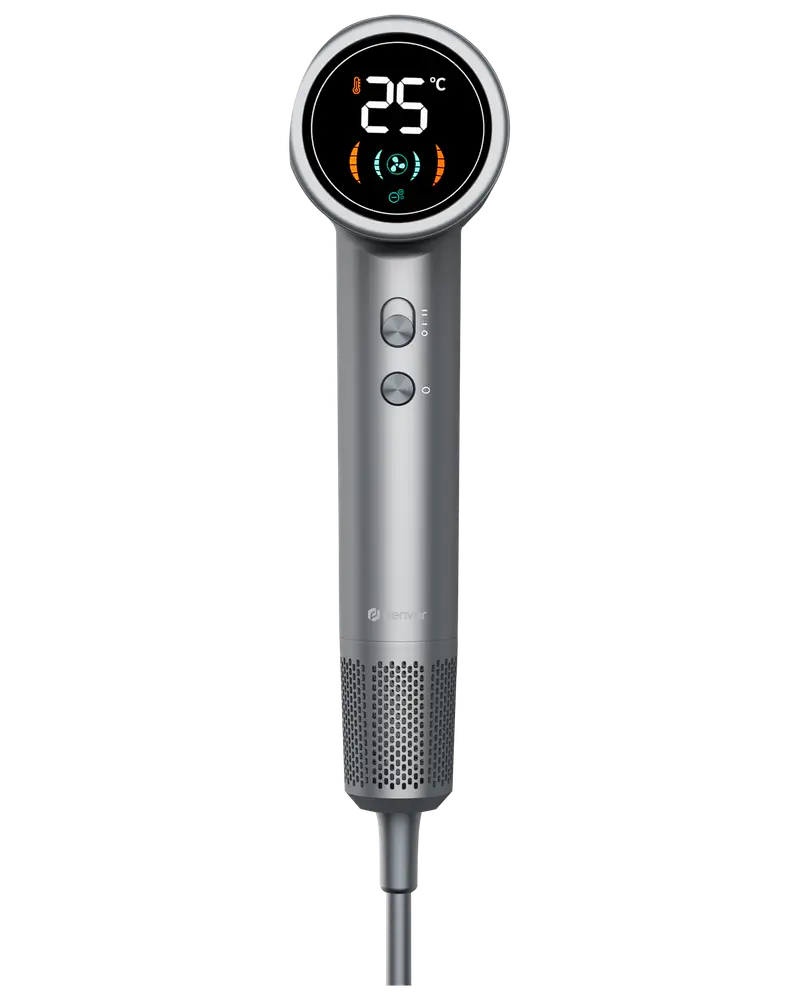 Elegant sølv hårtørrer med digitalt display, der viser temperatur, to kontrolknapper og perforeret nederste sektion for luftstrøm. Moderne, ergonomisk design til professionel eller hjemmebrug.