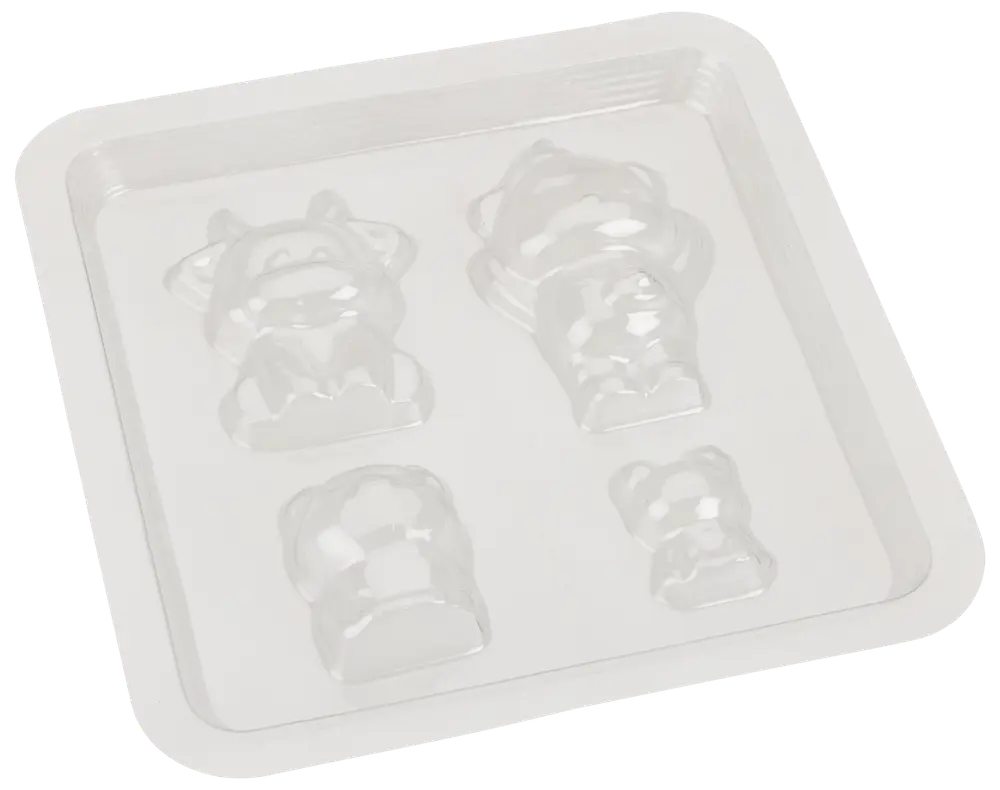 Gennemsigtig plastikform med fire dyreformede hulrum, perfekt til at lave chokolade eller slik. Indeholder detaljerede designs af ko, bjørn og andre dyr.