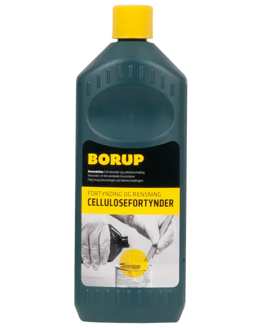 Mørk turkis BORUP-flaske med gul hætte, mærket cellulosefortynder og rensning, til fortynding og rengøring af maling.
