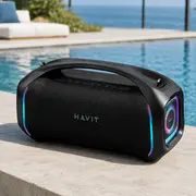 Bærbar sort HAVIT Bluetooth-højttaler med indbygget håndtag, LED-lysdetaljer og kontrolknapper på toppen. Robust design, velegnet til udendørs brug og fester.