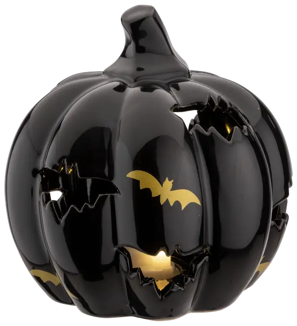 Blank svart keramisk pumpa med fladdermusformade utskärningar och gulddetaljer. Dekorativ Halloweenlykta där ljuset lyser genom utskärningarna.