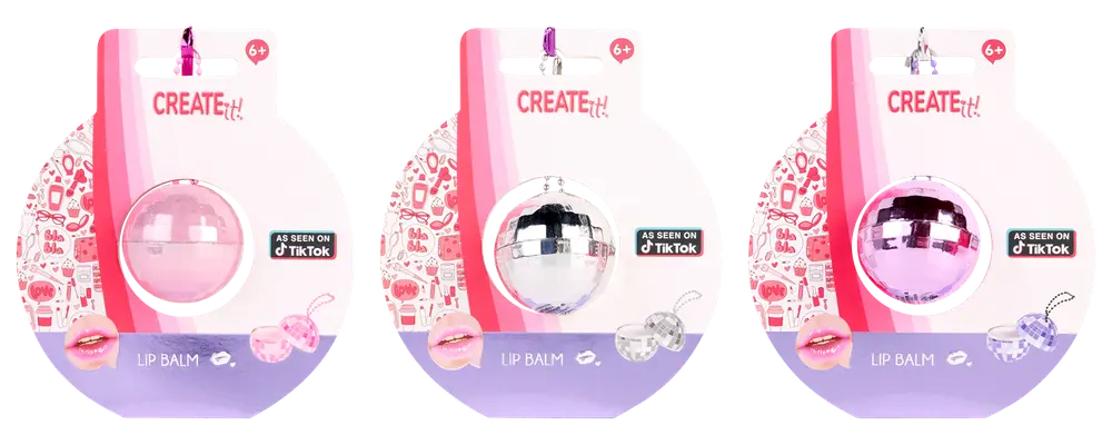 Create It! læbepomade formet som diskokugle i pink, sølv og lilla. Individuelt pakket, egnet til børn fra 6 år, fugtgivende, med nøgleringsvedhæng.