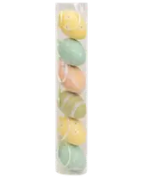 Sæt med seks dekorative påskeæg i pastelfarver med forskellige mønstre, pakket i en klar plastikæske. Perfekt til påskepynt eller hobbyprojekter.