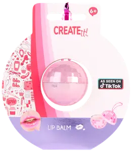 Kugleformet lyserød læbepomade i klar plastbeholder, pakket på farverigt kort med dekorationer. Velegnet til børn fra 6 år. Markedsført som set på TikTok.