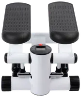 Kompakt mini-stepmaskin med två räfflade fotplattor, stabil vit ram och digital display för steg- och kaloriräkning. Perfekt för hemmaträning och benstyrka.