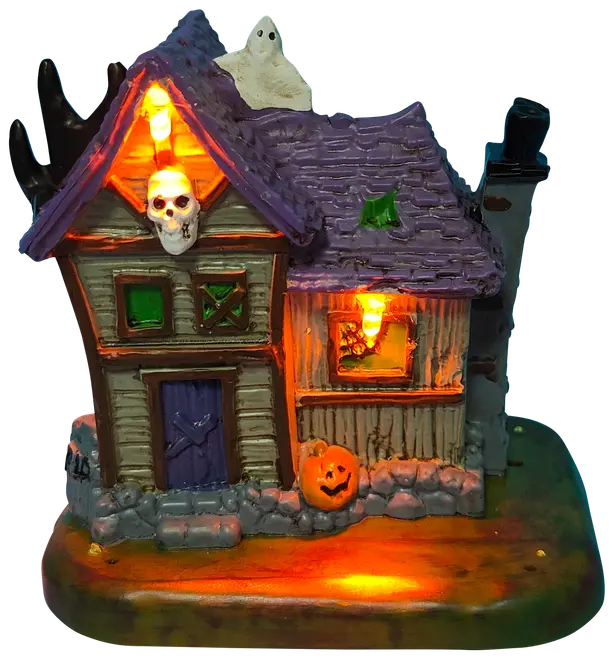 Halloween-dekoration: spökhus med lila tak, orange lampor, spökfigur på taket, pumpa, brädade fönster och stensockel. Tillverkad i målad resin, för bordsdekoration.