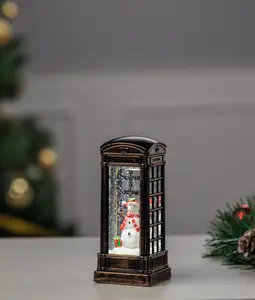 Snögubbe i telefonkiosk 