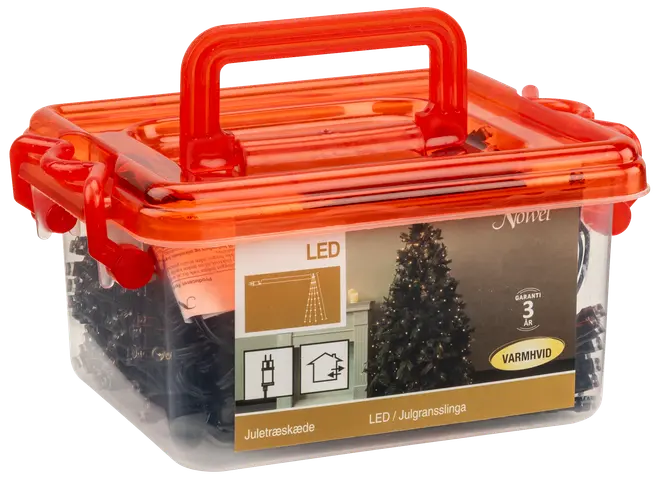 LED-julgransslinga med varmvit belysning, förpackad i transparent plastlåda med orange lock och handtag. För inomhusbruk, inkluderar kontakt, tre års garanti.