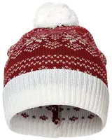 A knitted winter hat featuring a red body with white snowflake and geometric patterns, a wide white ribbed fold-over cuff, and a large fluffy white pom-pom on top. The inside of the hat is also lined with a similar pattern for added warmth and comfort.