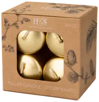 Æske med fire gyldne søjlelys, rund form, synlige væger. Pakket i brun papæske med botaniske illustrationer og vindue, der viser lysene.